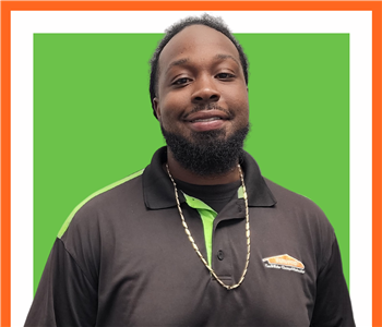 Rodney, SERVPRO employee in uniform, cut out in front of white background