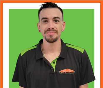 Kayce, SERVPRO employee cutout against a green background