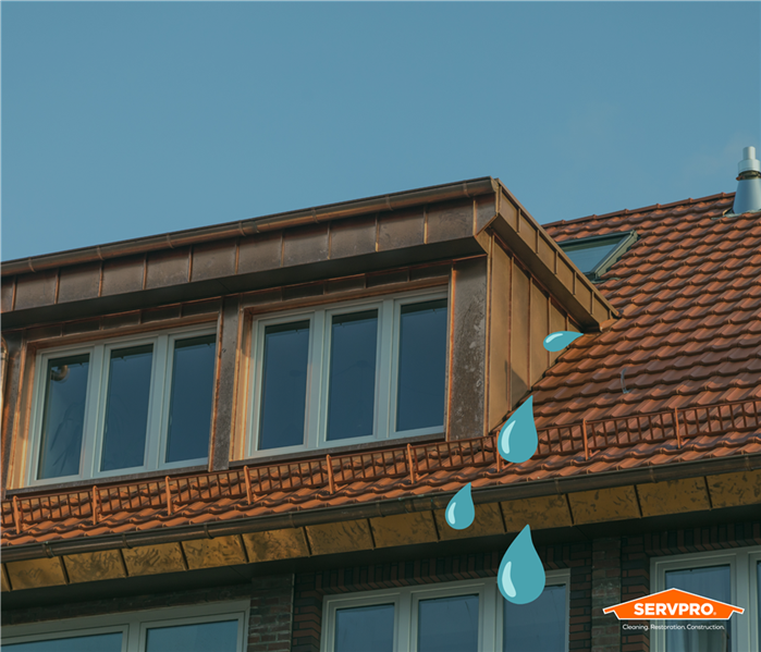 blue water drops coming from the roof of a home in Fort Worth, Texas